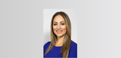 Headshot of Commissioner Castro smiling in blue, business attire